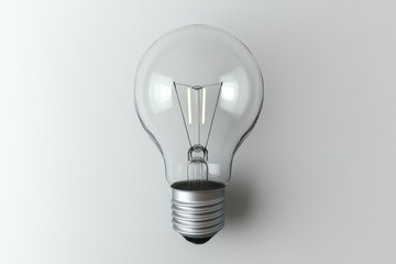 A close-up view of a classic incandescent light bulb against a neutral background