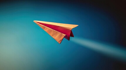 A colorful paper airplane soaring through a gradient background, symbolizing creativity and freedom in motion.