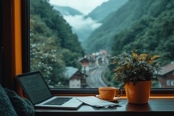  A person working remotely on a laptop while traveling by train through picturesque mountain landscapes