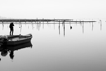 black and white photo of Porto Caleri with photographer