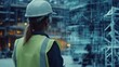 © pitu - Female Construction Worker Examining Digital Hologram of Building Plans
