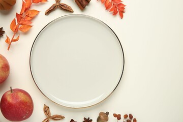 Canvas Print - Stylish plate and autumn decor on white background, flat lay