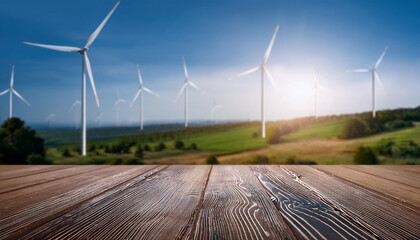 Empty table background of wind turbines on the horizon in a green rural landscape -Alternative renewable green energy
.clean energy day concept