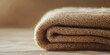 © Ice Cream Paradise - a folded woolen blanket with a soft, textured surface against an isolated dusty chocolate background