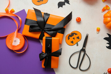 Poster - Halloween decorations with gift boxes and wrapping paper on white background