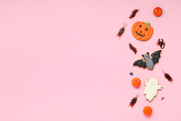 Wall Mural - Halloween composition with pumpkins and candy bugs on pink background