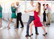 © JackF - Elegant couples dancing tango, enjoying dance moves in dance salon