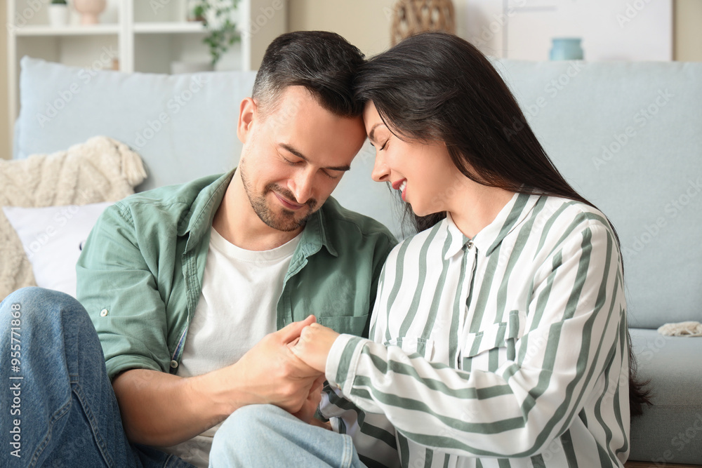Religious couple praying at home