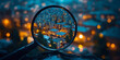 © Vertigo Images - A magnifying glass focuses on a city skyline at night, highlighting the details of the buildings and streets.