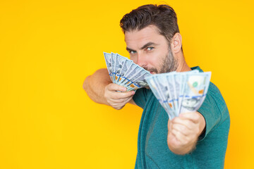 Business man counting money. Handsome middle age man holding bunch of 100 dollar banknotes. Guy holding money cash. Financial success. Rich man with dollar cash, hundred dollar bill.