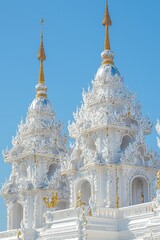 Wall Mural - White Temple Towers with Golden Finials and Intricate Detail