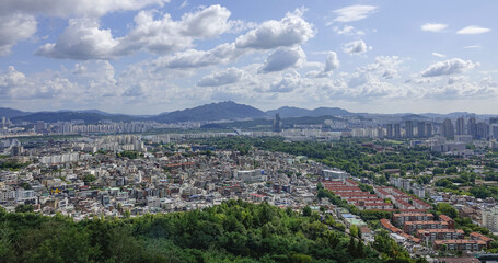 Wall Mural - Yongsan-gu, Seoul, South Korea - August 18, 2021: High angle and panoramic view of townhouses and highrise apartments seen from Namsan Mountain in summer