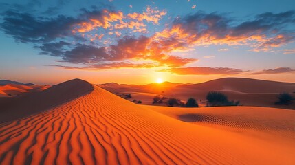 Canvas Print - sunrise over tranquil desert landscape with dunes and a sky filled with warm colors