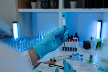 Wall Mural - a researcher is conducting scientific experiments on a liquid substance, a scientist is using labora