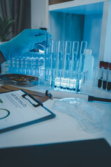 Wall Mural - a researcher is conducting scientific experiments on a liquid substance, a scientist is using labora