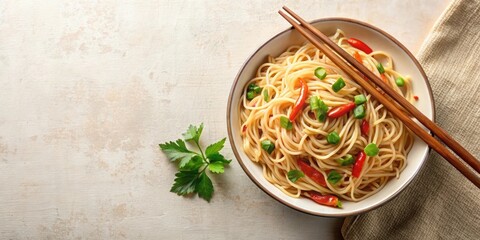 Wall Mural - Hakka noodles with chopsticks, green chopped chili on a pastel ivory background from top angle , Hakka noodles