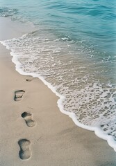 Wall Mural - Footprints on the sandy beach