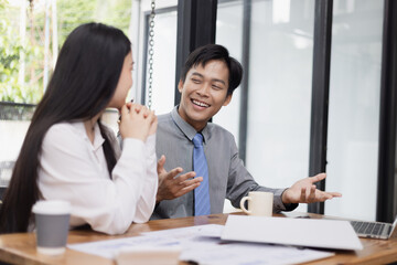 Business financial advisory services concept. Business teamwork and working on digital laptop computer with advisor showing plan of investment to clients at table office. Digital marketing.