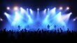© Zaenal - Silhouettes of crowd at concert in front of stage with bright spotlights. People enjoy live music at the band's performance. Concert hall with musicians on stage and fans during music festival.,
