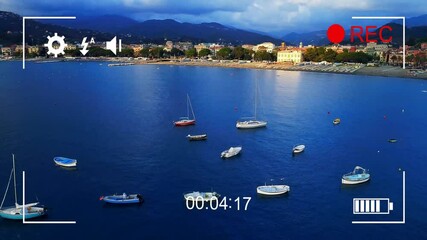 Wall Mural - Boats anchored in calm sea with video recording animation overlay