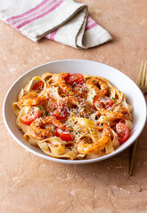 Pasta with shrimps, tomatoes and cheese. Healthy eating. Italian food.