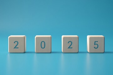 Wooden cubes spelling the word 2025 on a blue background, new year, business growth concept