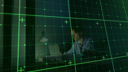 Canvas Print - Grid and data points animation over man working on laptop at desk