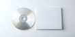 © Ehtisham - A blank CD/DVD disc and a white page mockup. perfect for showcasing your designs or products.