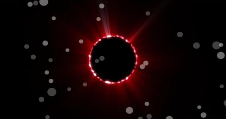 Wall Mural - Red glowing circle with light rays and white dots animation on black background