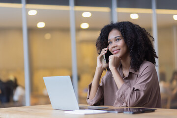 African American woman with smartphone, excited woman. 