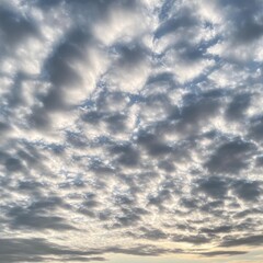 Canvas Print - A cloudy sky with a few patches of blue peeking through.