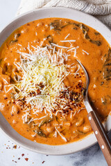 Canvas Print - Creamy tomato bean stew with spinach and cheese.