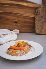 Wall Mural - Peanut butter toast with peach and seeds.