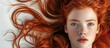 © StockKing - Portrait of a young girl with stunning flowing red hair on a white background with copy space image for hair care products