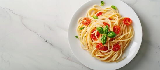 Wall Mural - Copy space image of basil topped spaghetti on a white plate suitable for articles recipes and design