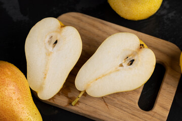 delicious yellow pears with a red side cut into pieces