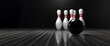 © pentolo - Black bowling ball in front of five white bowling pins on a wooden lane.