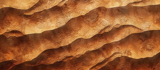 Brown sand with a textured appearance creates an abstract background suitable for a copy space image