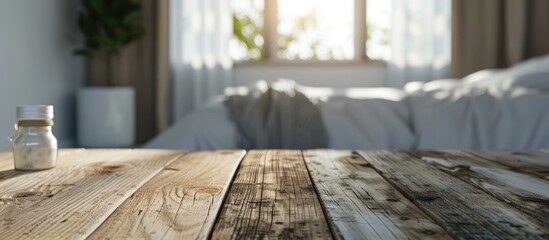 Poster - A wooden table stands empty with a blurred bedroom backdrop offering a space for displaying advertising products against a lovely background in the image. Creative banner. Copyspace image