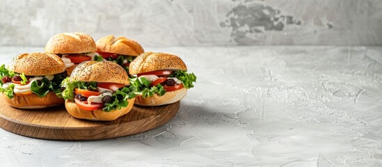 Aufkleber - Delicious roll sandwiches with raisin and white sauce beautifully arranged on a wooden plate against a white background for food photography with copy space image