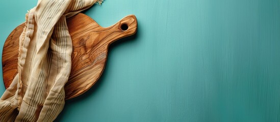 Poster - Top view of a cutting board with a napkin on a colored background providing copy space image
