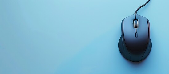 Poster - Top view of a wired mouse and mousepad on a light blue backdrop with copy space image available