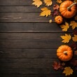 © Dmitriy - Autumn background with pumpkins and fall leaves on brown wood