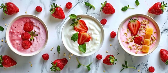 Aufkleber - Flat lay with breakfast bowls of fresh fruits yogurt porridge and whole strawberries on a marble table with copy space image