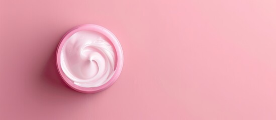 Sticker - Top view of face cream sample on a pink background with copy space image available