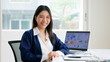 © ChayTee - Young adult woman asia people expert tech talent user happy smile looking at camera on AI project SEO visual big data science report center BI smart tools. Office IT worker asian analyst tax audit job