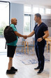 © Wavebreak Media - Man with prosthetic leg shaking hands with doctor in clinic lobby
