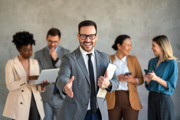 Wall Mural - Portrait of successful group of business people at office. Multiethnic group of people smiling.