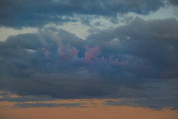 Sticker - Sunset sky with dark clouds. Soft magenta light on the clouds. Evening twilight sky  ..