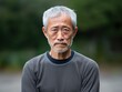 © Julian - Gray background sad Asian man. Portrait of older mid-aged person beautiful bad mood expression boy Isolated on Background depression anxiety fear